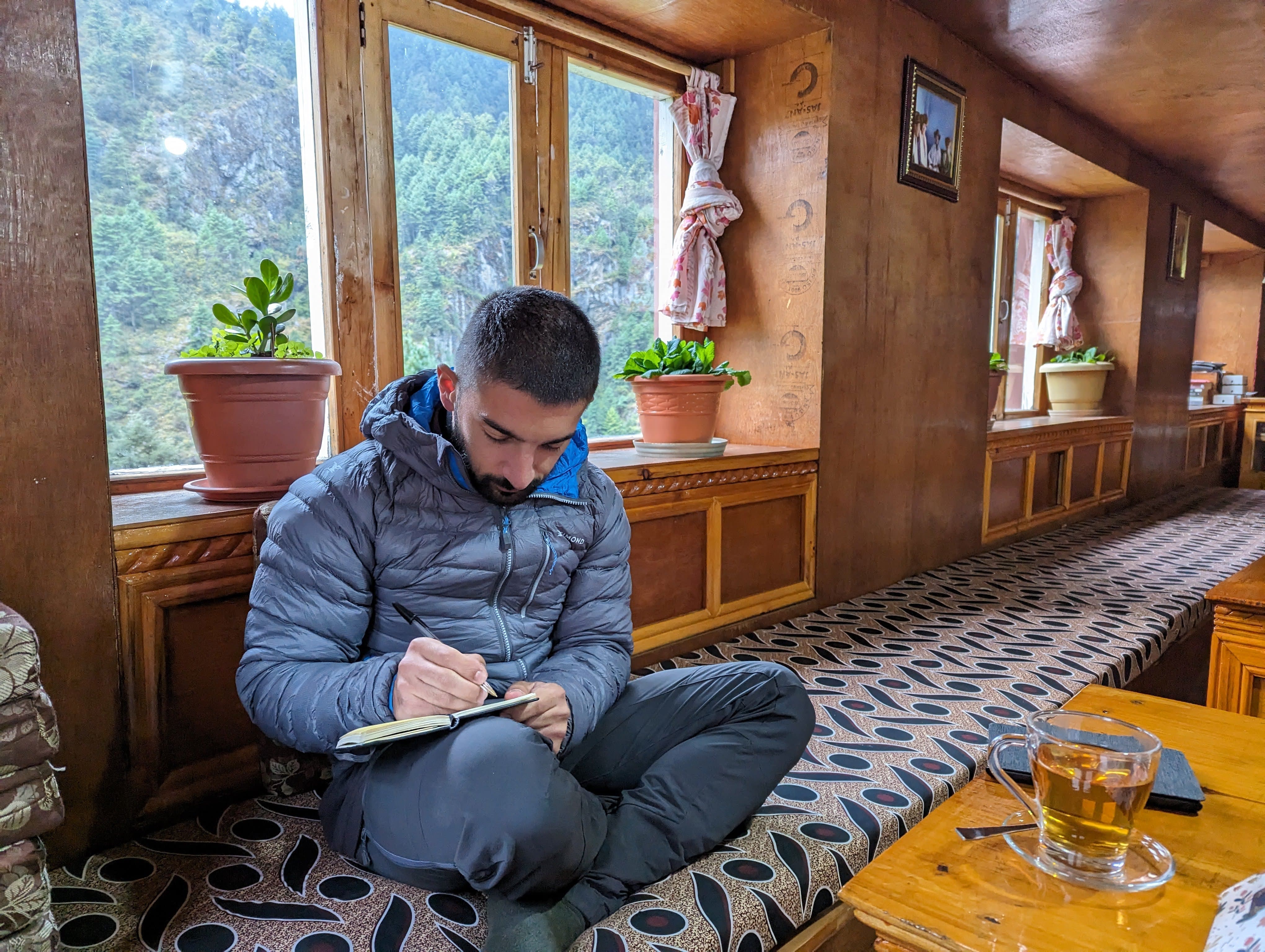 Writing in the journal at the end of the day in the teahouse common room